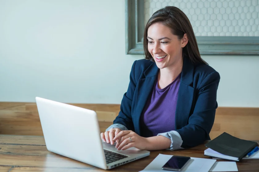 Ecommerce product listing service professional managing product data and listings on laptop