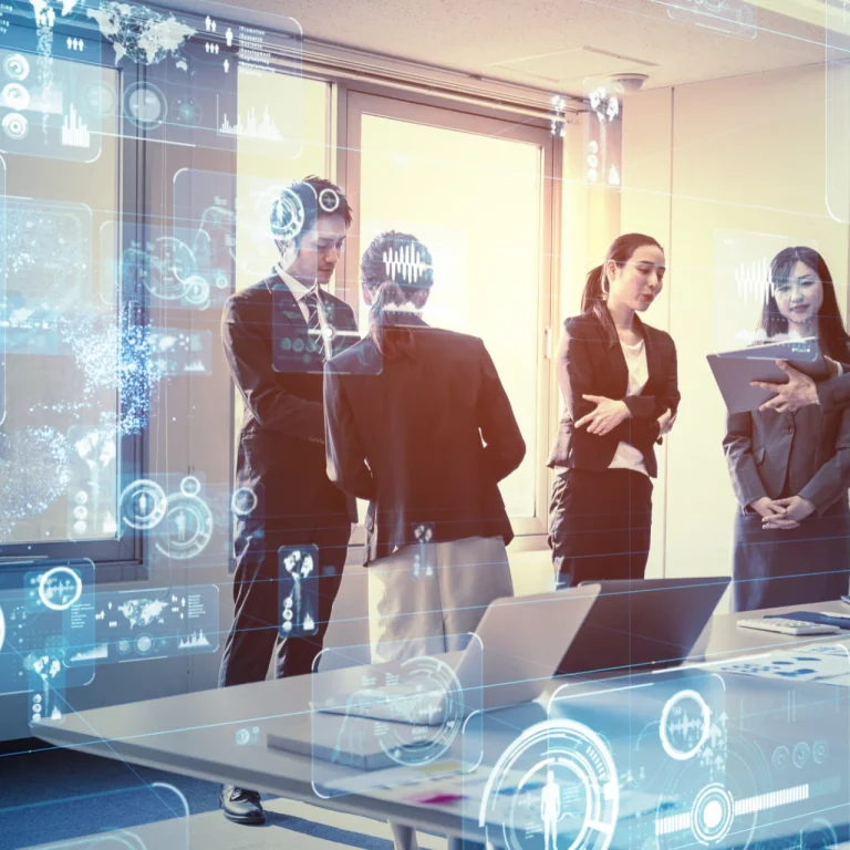 IT and technology business team discussing digital data analytics and innovation strategy in a modern office.