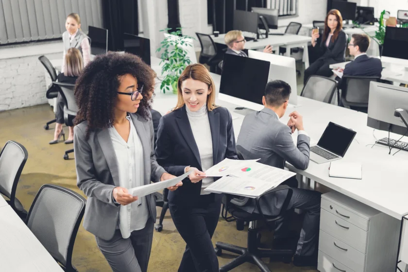 IT business team collaborating and reviewing data reports