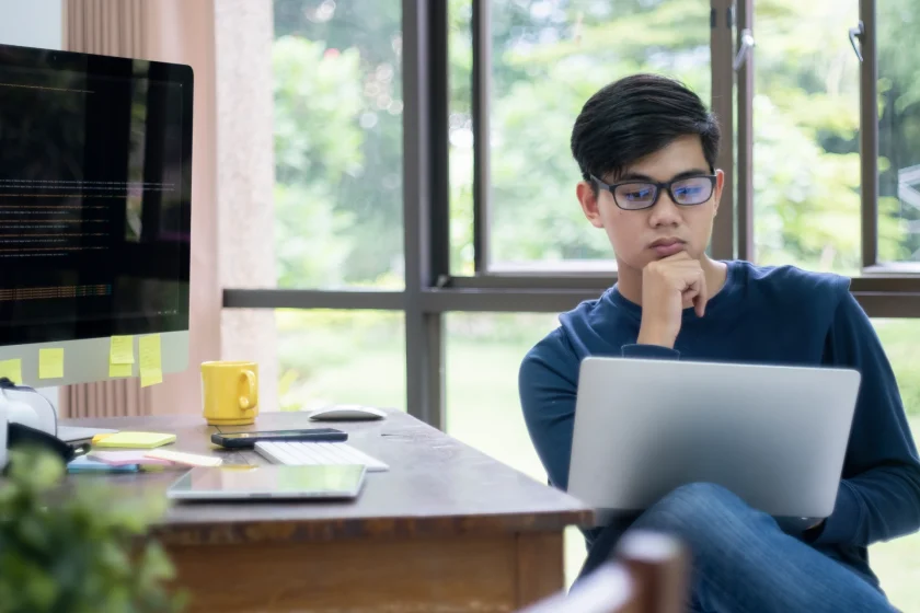 Starter website package setup, professional working on laptop to build and manage website