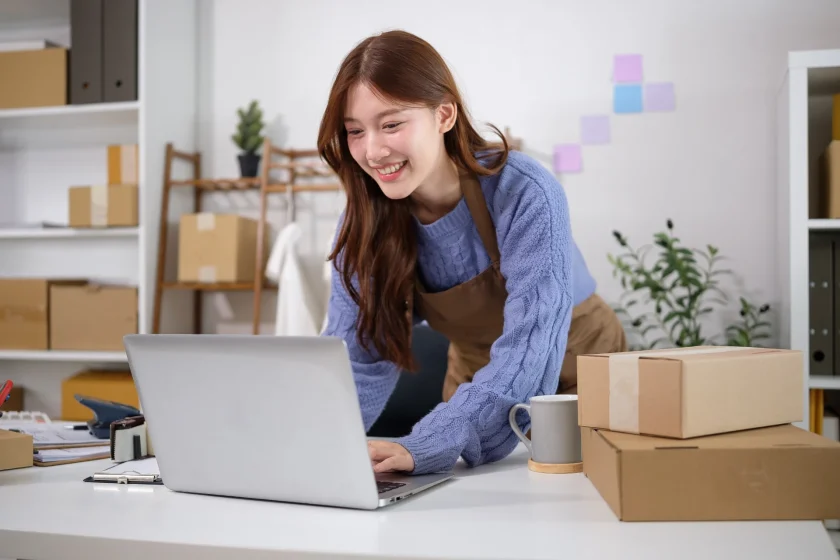 eCommerce entrepreneur managing products and orders from a laptop