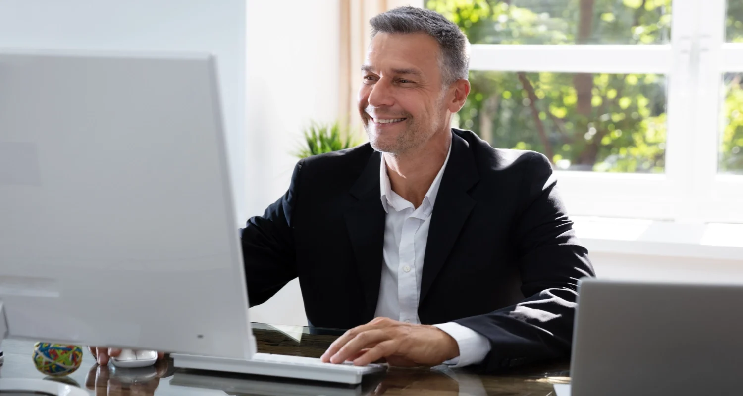 Professional managing AI automation workflows and business operations on a computer